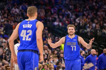 Feb 8, 2022; Dallas, Texas, USA; Dallas Mavericks forward Maxi Kleber (42) and guard Luka Doncic (77) celebrate during the second half against the Detroit Pistons at the American Airlines Center. Mandatory Credit: Jerome Miron-USA TODAY Sports