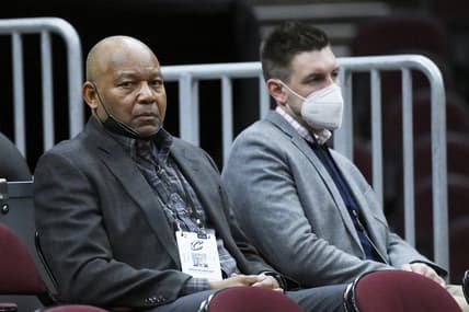 Feb 9, 2022; Cleveland, Ohio, USA; Cleveland Cavaliers senior basketball advisor Bernie Bickerstaff, left, and assistant general manager Mike Gansey sit in the stand before a game between the Cleveland Cavaliers and the San Antonio Spurs at Rocket Mortgage FieldHouse. Mandatory Credit: David Richard-USA TODAY Sports