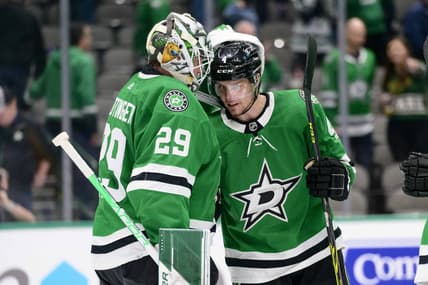 Feb 9, 2022; Dallas, Texas, USA; Dallas Stars goaltender Jake Oettinger (29) and defenseman Miro Heiskanen (4) celebrate the win over the Nashville Predators at the American Airlines Center. Mandatory Credit: Jerome Miron-USA TODAY Sports