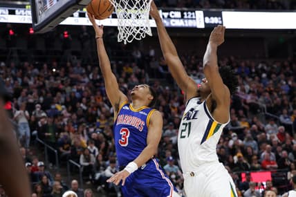 Feb 9, 2022; Salt Lake City, Utah, USA;  Utah Jazz center Hassan Whiteside (21) blocks the shot of Golden State Warriors guard Jordan Poole (3) during the second quarter at Vivint Arena. Mandatory Credit: Chris Nicoll-USA TODAY Sports