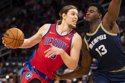 Feb 10, 2022; Detroit, Michigan, USA; Detroit Pistons forward Kelly Olynyk (13) drives to the basket against Memphis Grizzlies forward Jaren Jackson Jr. (13) during the second quarter at Little Caesars Arena. Mandatory Credit: Raj Mehta-USA TODAY Sports