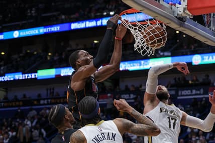 Feb 10, 2022; New Orleans, Louisiana, USA; Miami Heat center Bam Adebayo (13) dunks the ball against New Orleans Pelicans guard Jonas Valanciunas (17) during the first half at the Smoothie King Center. Mandatory Credit: Stephen Lew-USA TODAY Sports