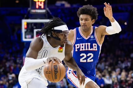 Feb 11, 2022; Philadelphia, Pennsylvania, USA; Oklahoma City Thunder forward Luguentz Dort (5) drives against Philadelphia 76ers guard Matisse Thybulle (22) during the first quarter at Wells Fargo Center. Mandatory Credit: Bill Streicher-USA TODAY Sports