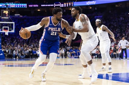 Feb 11, 2022; Philadelphia, Pennsylvania, USA; Philadelphia 76ers center Joel Embiid (21) dribbles the ball against Oklahoma City Thunder center Derrick Favors (15) during the third quarter at Wells Fargo Center. Mandatory Credit: Bill Streicher-USA TODAY Sports