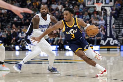 Feb 11, 2022; Salt Lake City, Utah, USA; Utah Jazz guard Trent Forrest (3) dribbles the ball past Orlando Magic guard Terrence Ross (31) during the second quarter at Vivint Arena. Mandatory Credit: Chris Nicoll-USA TODAY Sports