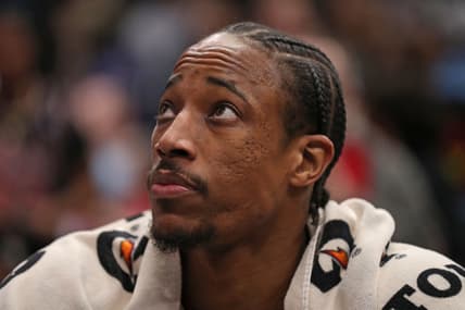Feb 11, 2022; Chicago, Illinois, USA; Chicago Bulls forward DeMar DeRozan (11) looks on from the bench during the second half against the Minnesota Timberwolves at the United Center. Mandatory Credit: Dennis Wierzbicki-USA TODAY Sports