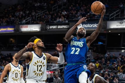 Feb 13, 2022; Indianapolis, Indiana, USA; Minnesota Timberwolves guard Patrick Beverley (22) shoots the ball while Indiana Pacers forward Oshae Brissett (12) defends in the first half at Gainbridge Fieldhouse. Mandatory Credit: Trevor Ruszkowski-USA TODAY Sports