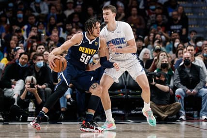 Feb 14, 2022; Denver, Colorado, USA; Denver Nuggets forward Aaron Gordon (50) controls the ball as Orlando Magic forward Franz Wagner (22) guards in the first quarter at Ball Arena. Mandatory Credit: Isaiah J. Downing-USA TODAY Sports