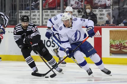 Feb 15, 2022; Newark, New Jersey, USA; Tampa Bay Lightning center Brayden Point (21) skates with the puck against the New Jersey Devils during the first period at Prudential Center. Mandatory Credit: Ed Mulholland-USA TODAY Sports