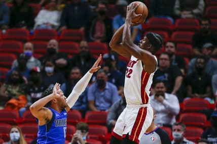 Feb 15, 2022; Miami, Florida, USA;  Miami Heat forward Jimmy Butler (22) shoots the basketball over Dallas Mavericks guard Jalen Brunson (13) during the first quarter at FTX Arena. Mandatory Credit: Sam Navarro-USA TODAY Sports