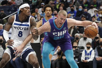 Feb 15, 2022; Minneapolis, Minnesota, USA; Charlotte Hornets center Mason Plumlee (24) works around Minnesota Timberwolves forward Jarred Vanderbilt (8) in the first quarter at Target Center. Mandatory Credit: Bruce Kluckhohn-USA TODAY Sports