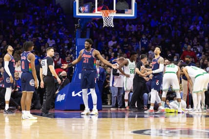 Feb 15, 2022; Philadelphia, Pennsylvania, USA; Philadelphia 76ers center Joel Embiid (21) argues a foul call with referee Gediminas Petraitis (50) while Boston Celtics guard Marcus Smart (36) lies on the court during the second quarter at Wells Fargo Center. Mandatory Credit: Bill Streicher-USA TODAY Sports