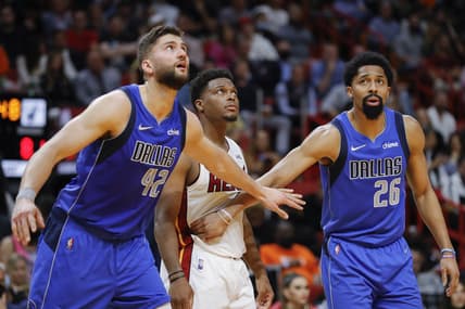 Feb 15, 2022; Miami, Florida, USA; Dallas Mavericks guard Spencer Dinwiddie (26) and Dallas Mavericks forward Davis Bertans (42) guard Miami Heat guard Kyle Lowry (7) during a free throw attempt during the fourth quarter at FTX Arena. Mandatory Credit: Sam Navarro-USA TODAY Sports
