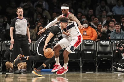Feb 17, 2022; Brooklyn, New York, USA;  Brooklyn Nets guard Seth Curry (30) drives past Washington Wizards guard Kentavious Caldwell-Pope (1) in the first quarter at Barclays Center. Mandatory Credit: Wendell Cruz-USA TODAY Sports