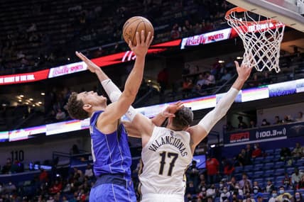 Feb 17, 2022; New Orleans, Louisiana, USA;  New Orleans Pelicans center Jonas Valanciunas (17) fouls Dallas Mavericks center Dwight Powell (7) during the first half at the Smoothie King Center. Mandatory Credit: Stephen Lew-USA TODAY Sports