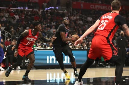 Feb 17, 2022; Los Angeles, California, USA; Los Angeles Clippers guard Reggie Jackson (1) drives to the basket against Houston Rockets guard Dennis Schroder (17) during the first half at Crypto.com Arena. The Clippers wins 142-111. Mandatory Credit: Kiyoshi Mio-USA TODAY Sports