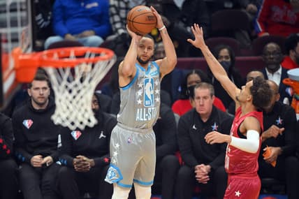 Feb 20, 2022; Cleveland, Ohio, USA; Team LeBron guard Stephen Curry (30) shoots a three point basket against Team Durant guard Trae Young (11) in the first quarter during the 2022 NBA All-Star Game at Rocket Mortgage FieldHouse. Mandatory Credit: David Richard-USA TODAY Sports