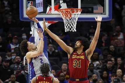 Feb 24, 2022; Detroit, Michigan, USA;  Detroit Pistons guard Cade Cunningham (2) shoots over Cleveland Cavaliers center Jarrett Allen (31) in the first half at Little Caesars Arena. Mandatory Credit: Rick Osentoski-USA TODAY Sports