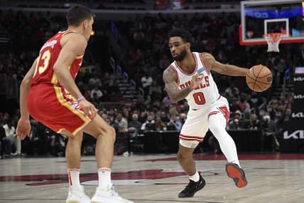Feb 24, 2022; Chicago, Illinois, USA;  Chicago Bulls guard Coby White (0) dribbles against Atlanta Hawks guard Bogdan Bogdanovic (13) during the first half at the United Center. Mandatory Credit: Matt Marton-USA TODAY Sports