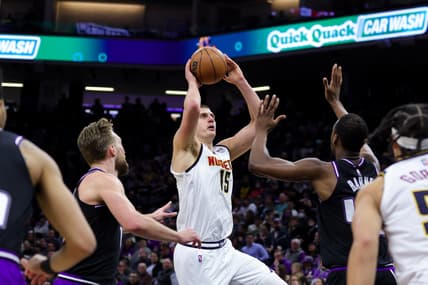 Feb 24, 2022; Sacramento, California, USA; Denver Nuggets center Nikola Jokic (15) shoots the ball over Sacramento Kings forward Harrison Barnes (40) during the second quarter at Golden 1 Center. Mandatory Credit: Sergio Estrada-USA TODAY Sports
