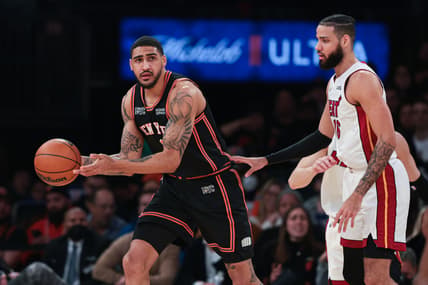 Feb 25, 2022; New York, New York, USA; New York Knicks forward Obi Toppin (1) passes the ball as Miami Heat forward Caleb Martin (16) defends during the first half at Madison Square Garden. Mandatory Credit: Vincent Carchietta-USA TODAY Sports