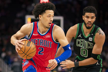 Feb 26, 2022; Detroit, Michigan, USA; Detroit Pistons guard Cade Cunningham (2) dribbles the ball against Boston Celtics forward Jayson Tatum (0) during the first quarter at Little Caesars Arena. Mandatory Credit: Raj Mehta-USA TODAY Sports