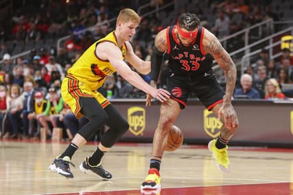 Feb 26, 2022; Atlanta, Georgia, USA; Atlanta Hawks guard Kevin Huerter (3) steals the ball from Toronto Raptors guard Gary Trent Jr. (33) in the first quarter at State Farm Arena. Mandatory Credit: Brett Davis-USA TODAY Sports