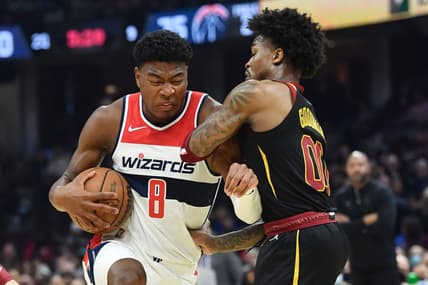 Feb 26, 2022; Cleveland, Ohio, USA; Washington Wizards forward Rui Hachimura (8) drives to the basket against Cleveland Cavaliers guard Brandon Goodwin (00) during the first half at Rocket Mortgage FieldHouse. Mandatory Credit: Ken Blaze-USA TODAY Sports