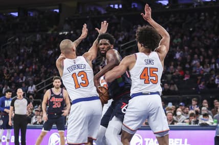 Feb 27, 2022; New York, New York, USA;  Philadelphia 76ers center Joel Embiid (21) is double teamed by New York Knicks guard Evan Fournier (13) and forward Jericho Sims (45) in the first quarter at Madison Square Garden. Mandatory Credit: Wendell Cruz-USA TODAY Sports