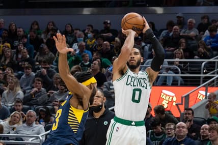Feb 27, 2022; Indianapolis, Indiana, USA; Boston Celtics forward Jayson Tatum (0) shoots the ball while Indiana Pacers forward Isaiah Jackson (23) defends in the second half at Gainbridge Fieldhouse. Mandatory Credit: Trevor Ruszkowski-USA TODAY Sports