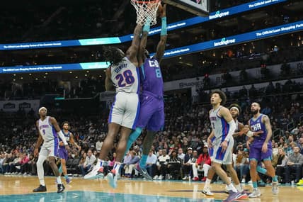 Feb 27, 2022; Charlotte, North Carolina, USA; Charlotte Hornets center Montrezl Harrell (8) is fouled going up for a shot covered by Detroit Pistons center Isaiah Stewart (28) during the second quarter at the Spectrum Center. Mandatory Credit: Jim Dedmon-USA TODAY Sportsthe