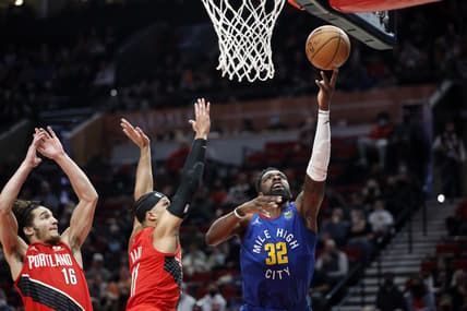 Feb 27, 2022; Portland, Oregon, USA; Denver Nuggets power forward Jeff Green (32) drives to the basket against Portland Trail Blazers shooting guard Josh Hart (11) during the first half at Moda Center. Mandatory Credit: Soobum Im-USA TODAY Sports