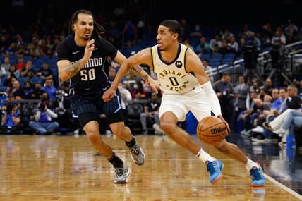 Feb 28, 2022; Orlando, Florida, USA;  Indiana Pacers guard Tyrese Haliburton (0) drives the ball past Orlando Magic guard Cole Anthony (50) in the first quarter at Amway Center. Mandatory Credit: Nathan Ray Seebeck-USA TODAY Sports