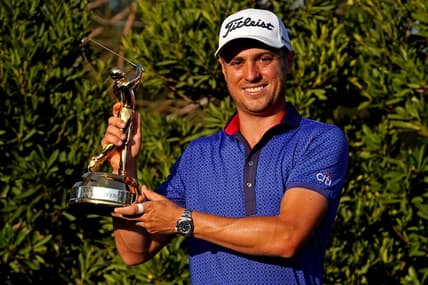 Mar 14, 2021; Ponte Vedra Beach, Florida, USA; Justin Thomas celebrates with the trophy after winning The Players Championship golf tournament at TPC Sawgrass - Stadium Course. Mandatory Credit: Jasen Vinlove-USA TODAY Sports