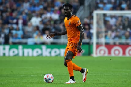 Aug 7, 2021; Saint Paul, MN, USA; Houston Dynamo midfielder Derrick Jones (21) dribbles the ball against Minnesota United in the first half at Allianz Field. Mandatory Credit: David Berding-USA TODAY Sports