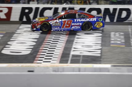 Sep 11, 2021; Richmond, Virginia, USA; NASCAR Cup Series driver Martin Truex Jr. (19) cross the finish line to win the Federated Auto Parts 400 Salute to First Responders at Richmond International Raceway. Mandatory Credit: Amber Searls-USA TODAY Sports