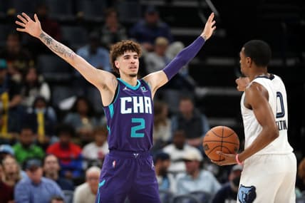 Nov 10, 2021; Memphis, Tennessee, USA; Charlotte Hornets guard LaMelo Ball (2) defends Memphis Grizzles guard De'Anthony Melton (0) during the first half at FedExForum. Mandatory Credit: Petre Thomas-USA TODAY Sports