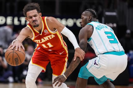 Nov 20, 2021; Atlanta, Georgia, USA; Atlanta Hawks guard Trae Young (11) tries to get past Charlotte Hornets guard Terry Rozier (3) during the second half at State Farm Arena. Mandatory Credit: Dale Zanine-USA TODAY Sports