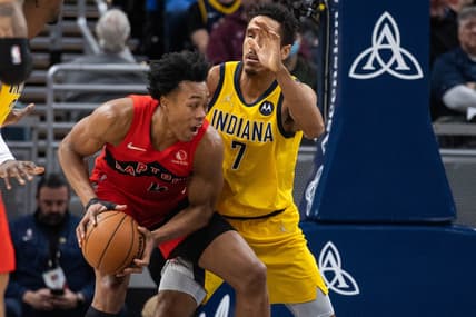Nov 26, 2021; Indianapolis, Indiana, USA; Toronto Raptors forward Scottie Barnes (4) moves to shoot the ball while Indiana Pacers guard Malcolm Brogdon (7) defends in the second half at Gainbridge Fieldhouse. Mandatory Credit: Trevor Ruszkowski-USA TODAY Sports