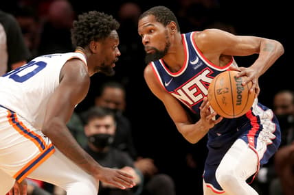 Nov 30, 2021; Brooklyn, New York, USA; Brooklyn Nets forward Kevin Durant (7) drives around New York Knicks forward Julius Randle (30) during the second quarter at Barclays Center. Mandatory Credit: Brad Penner-USA TODAY Sports