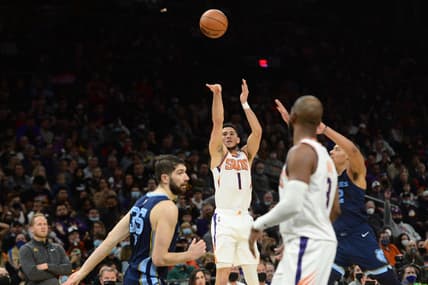 Dec 27, 2021; Phoenix, Arizona, USA; Phoenix Suns guard Devin Booker (1) shoots against the Memphis Grizzlies during the second half at Footprint Center. Mandatory Credit: Joe Camporeale-USA TODAY Sports
