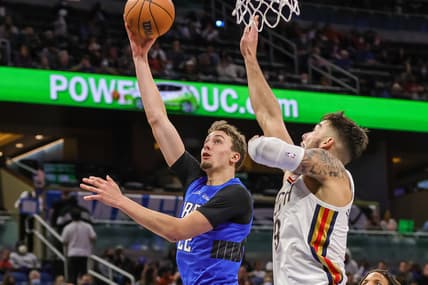 Dec 23, 2021; Orlando, Florida, USA; Orlando Magic forward Franz Wagner (22) shoots the ball against New Orleans Pelicans center Willy Hernangomez (9) during the second quarter at Amway Center. Mandatory Credit: Mike Watters-USA TODAY Sports