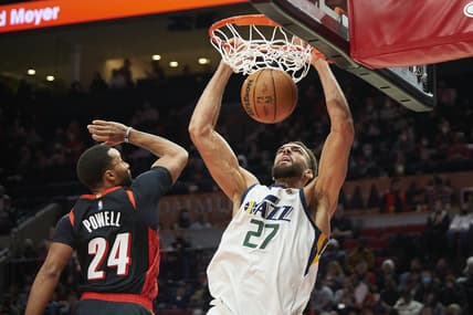 Dec 29, 2021; Portland, Oregon, USA; Utah Jazz center Rudy Gobert (27) dunks the ball during the second half against Portland Trail Blazers forward Norman Powell (24) at Moda Center. The Jazz won the game 120-105. Mandatory Credit: Troy Wayrynen-USA TODAY Sports