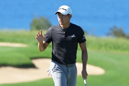 January 8, 2022; Maui, Hawaii, USA; Collin Morikawa acknowledges the crowd after making his putt on the 13th hole during the third round of the Sentry Tournament of Champions golf tournament at Kapalua Resort - The Plantation Course. Mandatory Credit: Kyle Terada-USA TODAY Sports