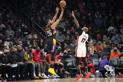 Jan 8, 2022; Phoenix, Arizona, USA; Phoenix Suns forward Mikal Bridges (25) shoots over Miami Heat forward P.J. Tucker (17) during the second half at Footprint Center. Mandatory Credit: Joe Camporeale-USA TODAY Sports