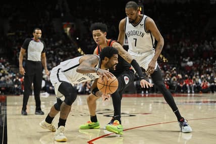 Jan 10, 2022; Portland, Oregon, USA;  Brooklyn Nets forward Kevin Durant (7) sets a pick during the first half against Portland Trail Blazers guard Anfernee Simons (1) as guard Kyrie Irving (11) drives to the basket at Moda Center. Mandatory Credit: Troy Wayrynen-USA TODAY Sports
