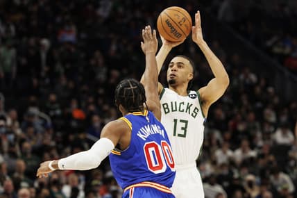 Jan 13, 2022; Milwaukee, Wisconsin, USA;  Milwaukee Bucks forward Jordan Nwora (13) shoots against Golden State Warriors forward Jonathan Kuminga (0) during the fourth quarter at Fiserv Forum. Mandatory Credit: Jeff Hanisch-USA TODAY Sports