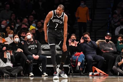 Jan 15, 2022; Brooklyn, New York, USA; Brooklyn Nets forward Kevin Durant (7) holds his knee after a collision against the New Orleans Pelicans during the second quarter at Barclays Center. Mandatory Credit: Dennis Schneidler-USA TODAY Sports