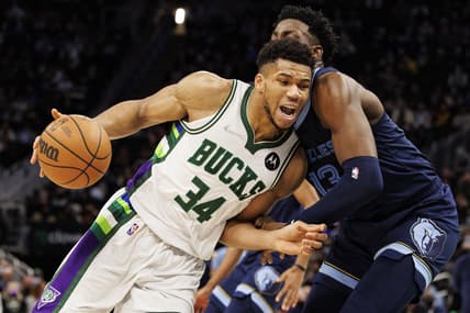 Jan 19, 2022; Milwaukee, Wisconsin, USA;  Milwaukee Bucks forward Giannis Antetokounmpo (34) drives for the basket against Memphis Grizzlies forward Jaren Jackson Jr. (13) during the fourth quarter at Fiserv Forum. Mandatory Credit: Jeff Hanisch-USA TODAY Sports