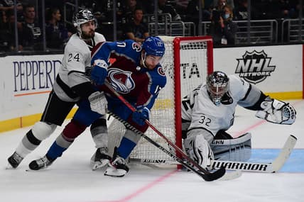 Jan 20, 2022; Los Angeles, California, USA; Colorado Avalanche center Tyson Jost (17) moves in for a shot on goal against Los Angeles Kings goaltender Jonathan Quick (32) and center Phillip Danault (24) during the third period at Crypto.com Arena. Mandatory Credit: Gary A. Vasquez-USA TODAY Sports